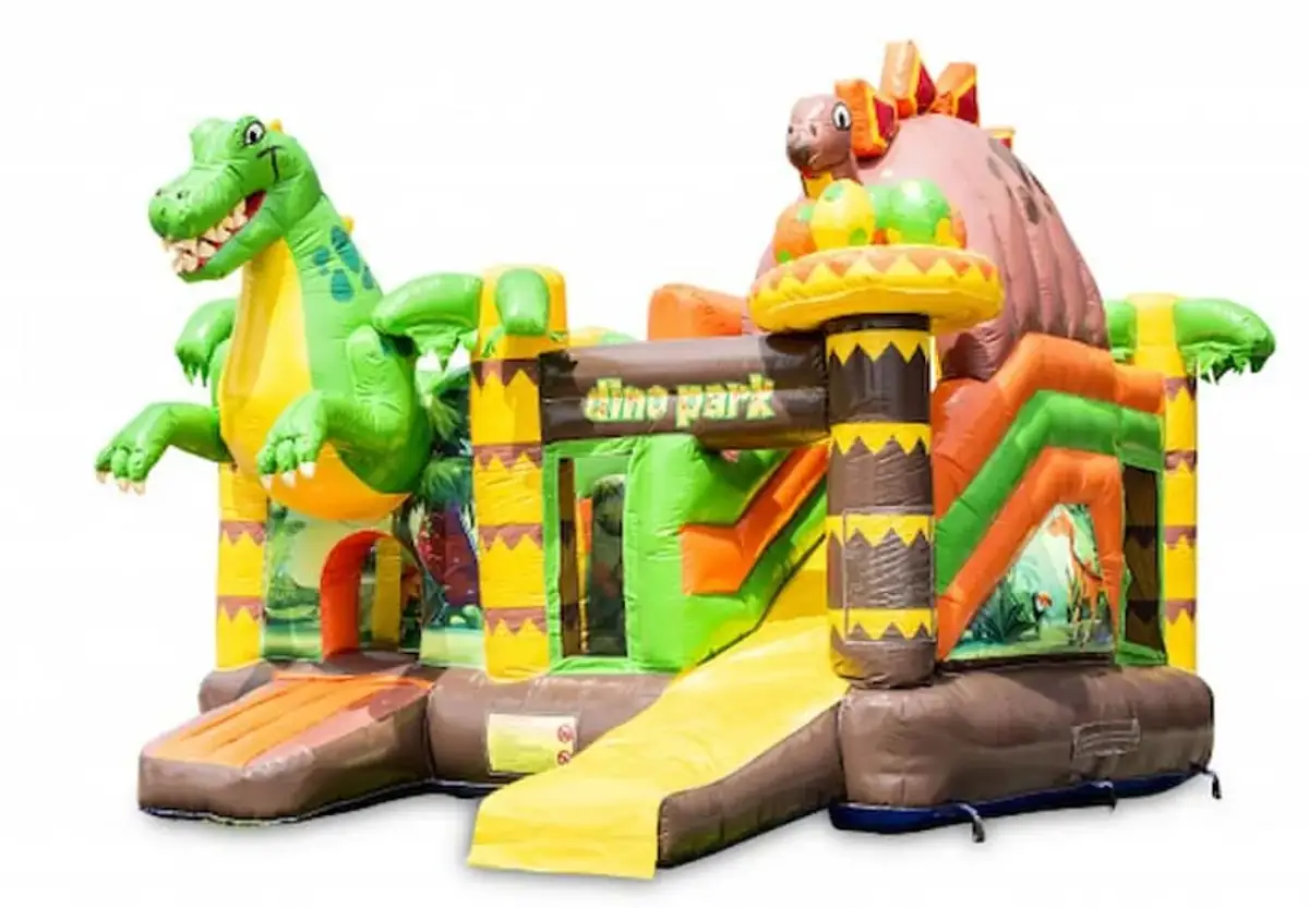 Château gonflable Dinoworld thème dinosaures avec toboggan, en location dans le Haut-Rhin